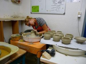 Jennifer throws in her studio.